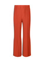 A product shot of the HOMME PLISSÉ ISSEY MIYAKE PLEATS BOTTOMS 1 trousers in brightside red.