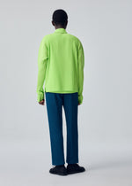 A model wears the HOMME PLISSÉ ISSEY MIYAKE TAILORED PLEATS 1 tailored-pleats-1-trousers-shadow-brown.