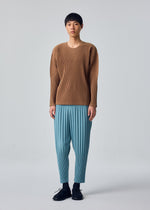 A model wears the HOMME PLISSÉ ISSEY MIYAKE COLOR PLEATS 2 color-pleats-2-trousers-flash-grey-1.
