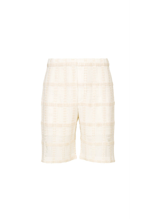 A product shot of the HOMME PLISSÉ ISSEY MIYAKE LACE GRID PLEATS shorts in white.