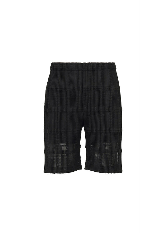 A product shot of the HOMME PLISSÉ ISSEY MIYAKE LACE GRID PLEATS shorts in black.
