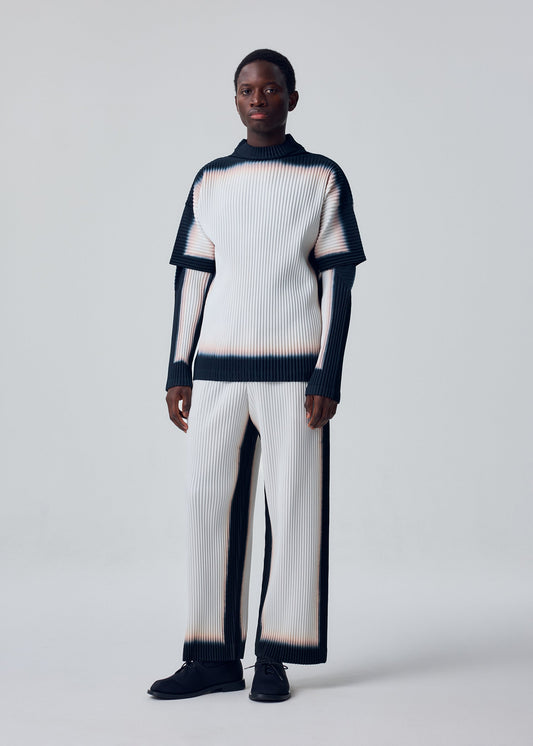 A model wears the HOMME PLISSÉ ISSEY MIYAKE FRAMEWORK : CHUSEN framework-chusen-trousers-black.
