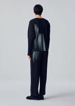 A model wears the HOMME PLISSÉ ISSEY MIYAKE IN THE SHADOW in-the-shadow-trousers-shadow-black.