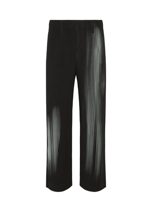 A product shot of the HOMME PLISSÉ ISSEY MIYAKE IN THE SHADOW trousers in shadow black.