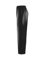 A detail shot of the HOMME PLISSÉ ISSEY MIYAKE IN THE SHADOW trousers.