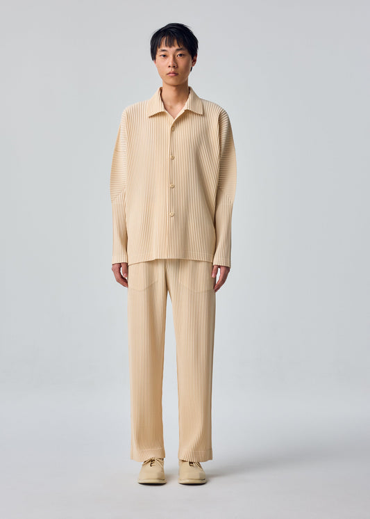 A model wears the HOMME PLISSÉ ISSEY MIYAKE MONTHLY COLORS : OCTOBER monthly-colors-october-long-sleeved-shirt-glow-cream.
