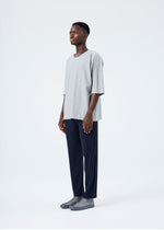 A model wears the HOMME PLISSÉ ISSEY MIYAKE RELEASE-T BASIC release-t-basic-top-black-4.