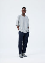 A model wears the HOMME PLISSÉ ISSEY MIYAKE RELEASE-T BASIC top.