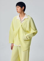 A model wears the HOMME PLISSÉ ISSEY MIYAKE SLASH slash-jacket-dim-green.