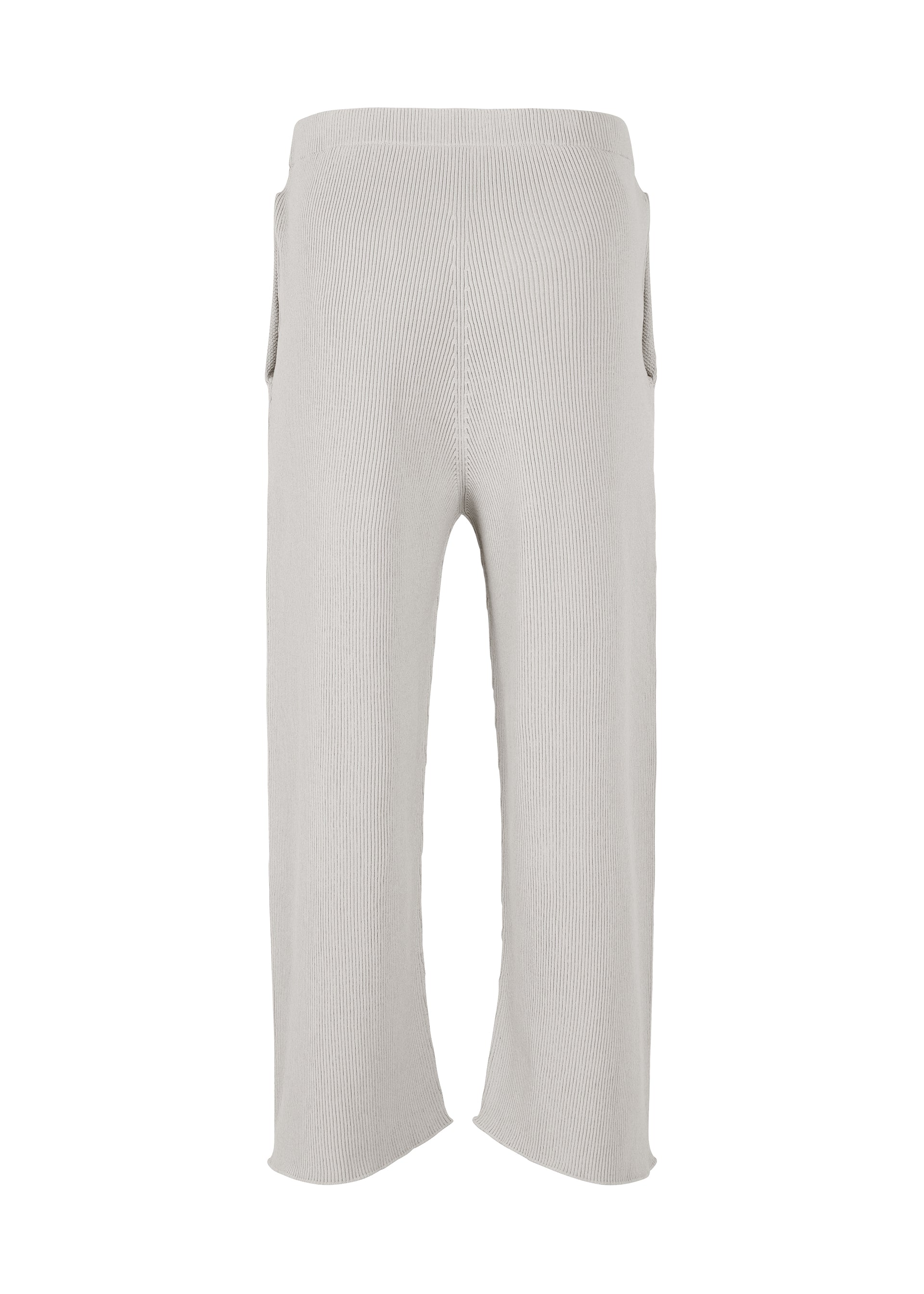 A detail shot of the HOMME PLISSÉ ISSEY MIYAKE BASIC KNIT trousers.