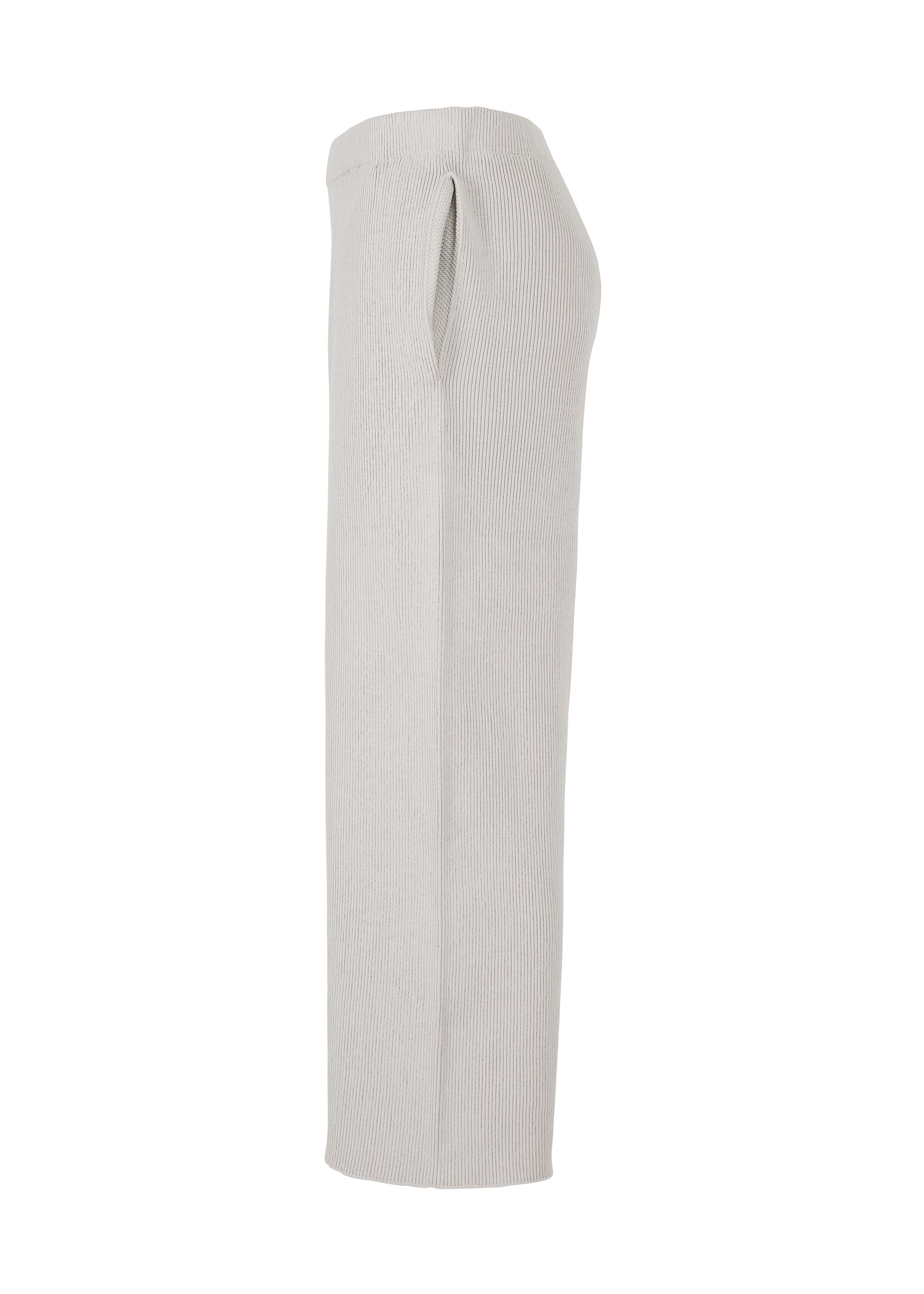 A detail shot of the HOMME PLISSÉ ISSEY MIYAKE BASIC KNIT trousers.