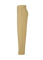 A detail shot of the HOMME PLISSÉ ISSEY MIYAKE RUSTIC KNIT trousers.