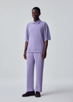 A model wears the HOMME PLISSÉ ISSEY MIYAKE WASHI FRAMEWORK-T top.