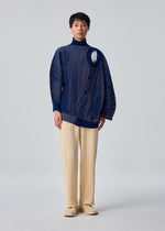 A model wears the HOMME PLISSÉ ISSEY MIYAKE IN THE SHADOW KNIT in-the-shadow-knit-cardigan-blue.