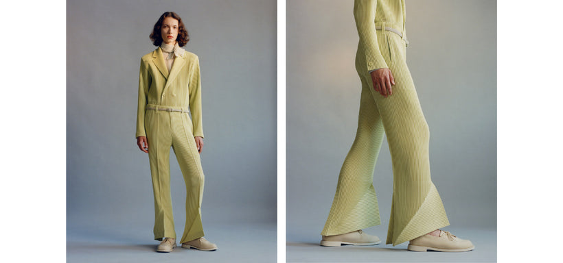 Left: Model wearing LINEN LIKE Jacket and Trousers in Agave Cream Green, in a relaxed pose against a grey background. Right: Model wearing LINEN LIKE Jacket and Trousers in Agave Cream Green, in a close-up, confident pose against a grey background.