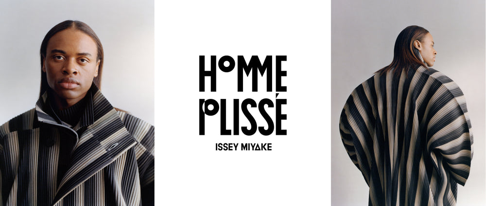 Centre image: HOMME PLISSÉ ISSEY MIYAKE logo in black writing on a white background. Left image: Model wearing RB_STRIPES 2 Jacket in Black, looking straight into the camera. Light grey background. Right image: Model wearing RB_STRIPES 2 Jacket in Black, facing away, glancing over the right shoulder. Dark grey background.