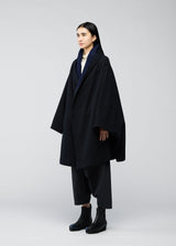 A model wears the 132 5. ISSEY MIYAKE ONE CLOTH COAT coat.