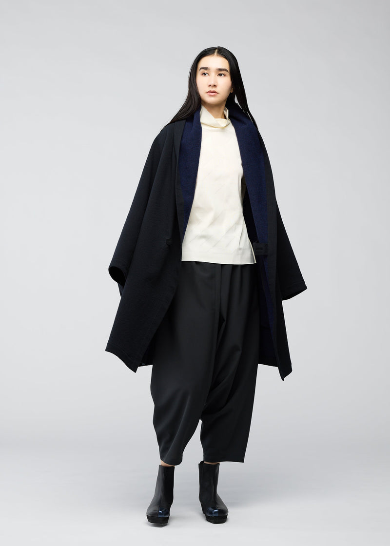 A model wears the 132 5. ISSEY MIYAKE ONE CLOTH COAT coat.