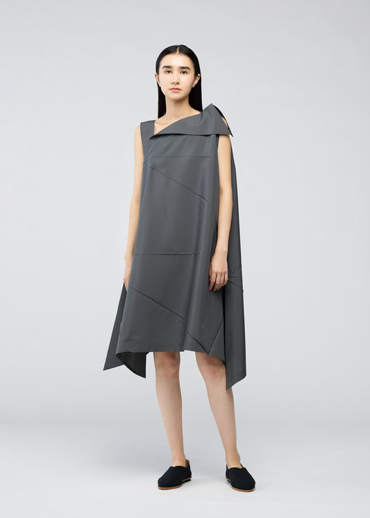 A model wears the 132 5. ISSEY MIYAKE  FRACTAL SOLID dress