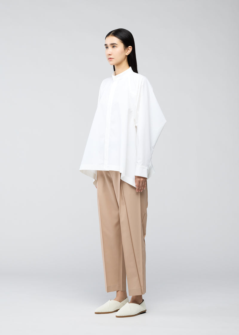 A model wears the 132 5. ISSEY MIYAKE  TRAPEZOID SHIRT shirt