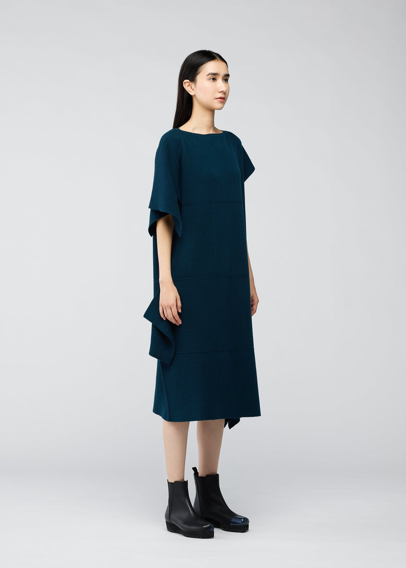 A model wears the 132 5. ISSEY MIYAKE BRICK KNIT dress.