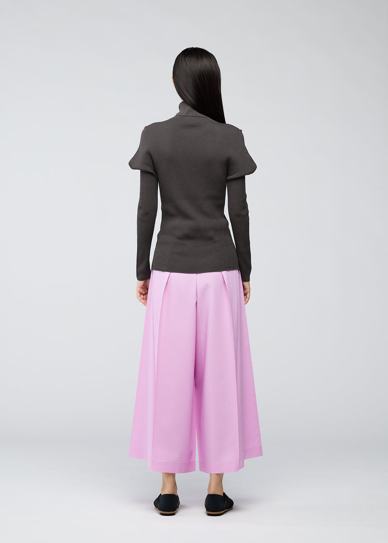 A model wears the 132 5. ISSEY MIYAKE  FLAT RIB KNIT top