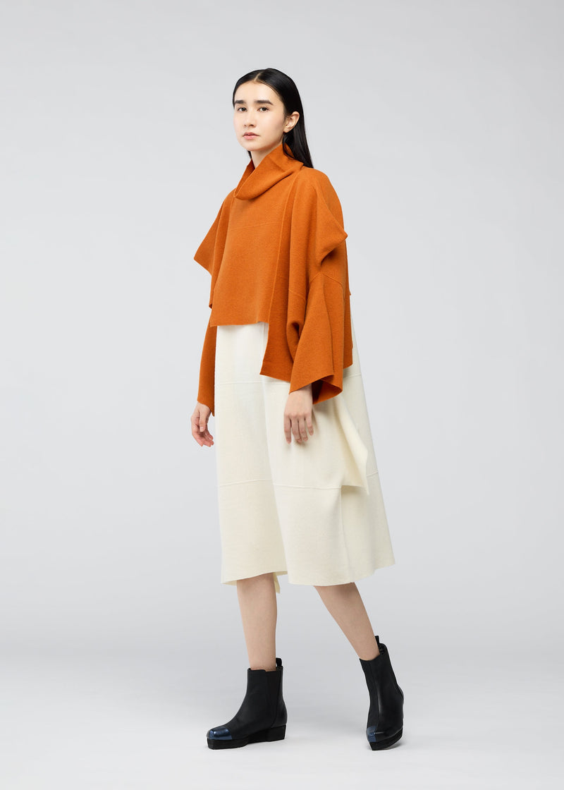 A model wears the 132 5. ISSEY MIYAKE BRICK KNIT top.