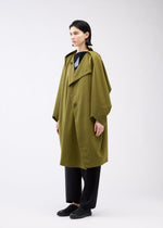 A model wears the 132 5. ISSEY MIYAKE PARALLEL WRAP coat.