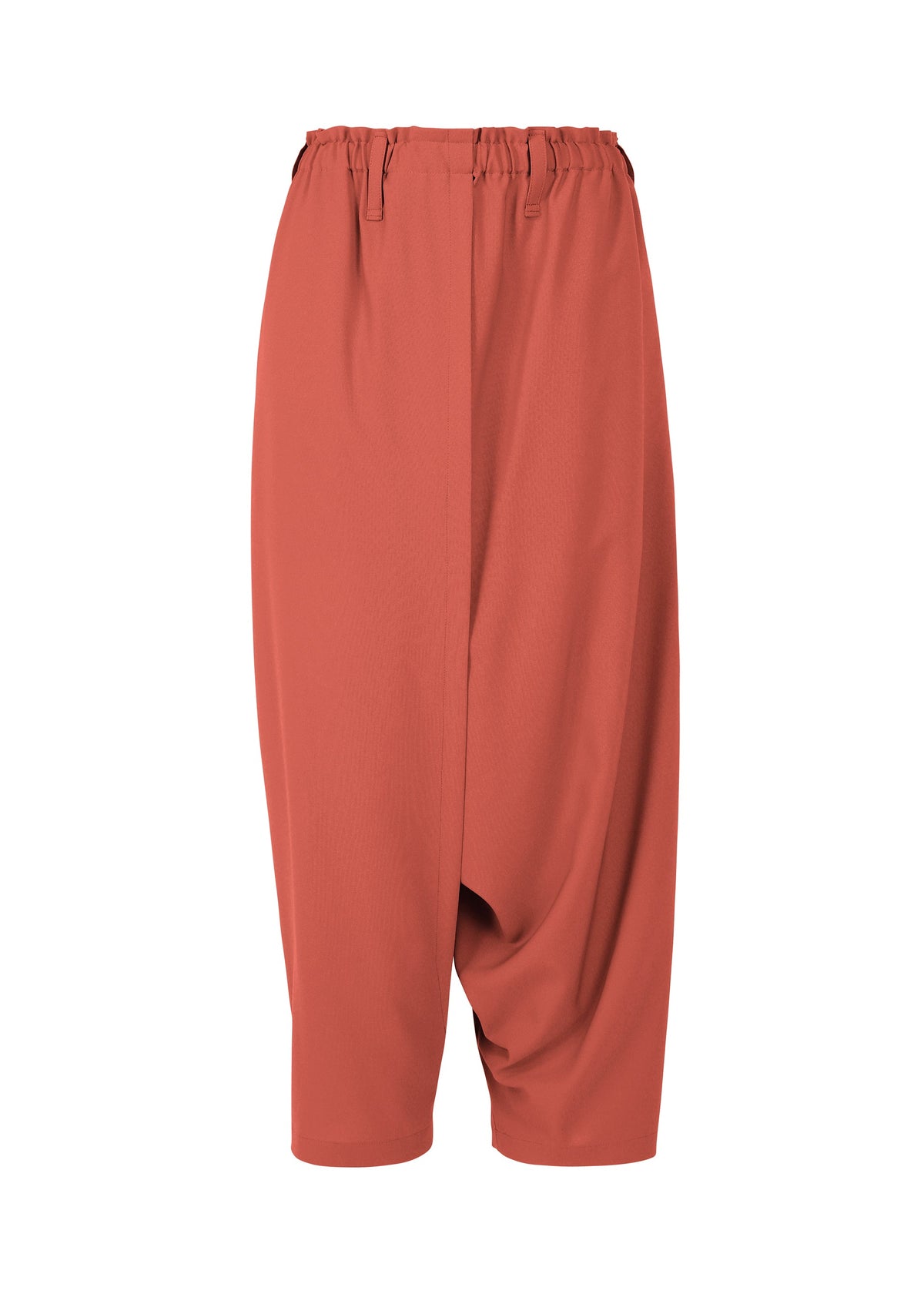 A product shot of the 132 5. ISSEY MIYAKE SEAMLESS 1 trousers in terracotta (23).