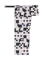 A detail shot of the 132 5. ISSEY MIYAKE BOX COMPOSITION trousers.