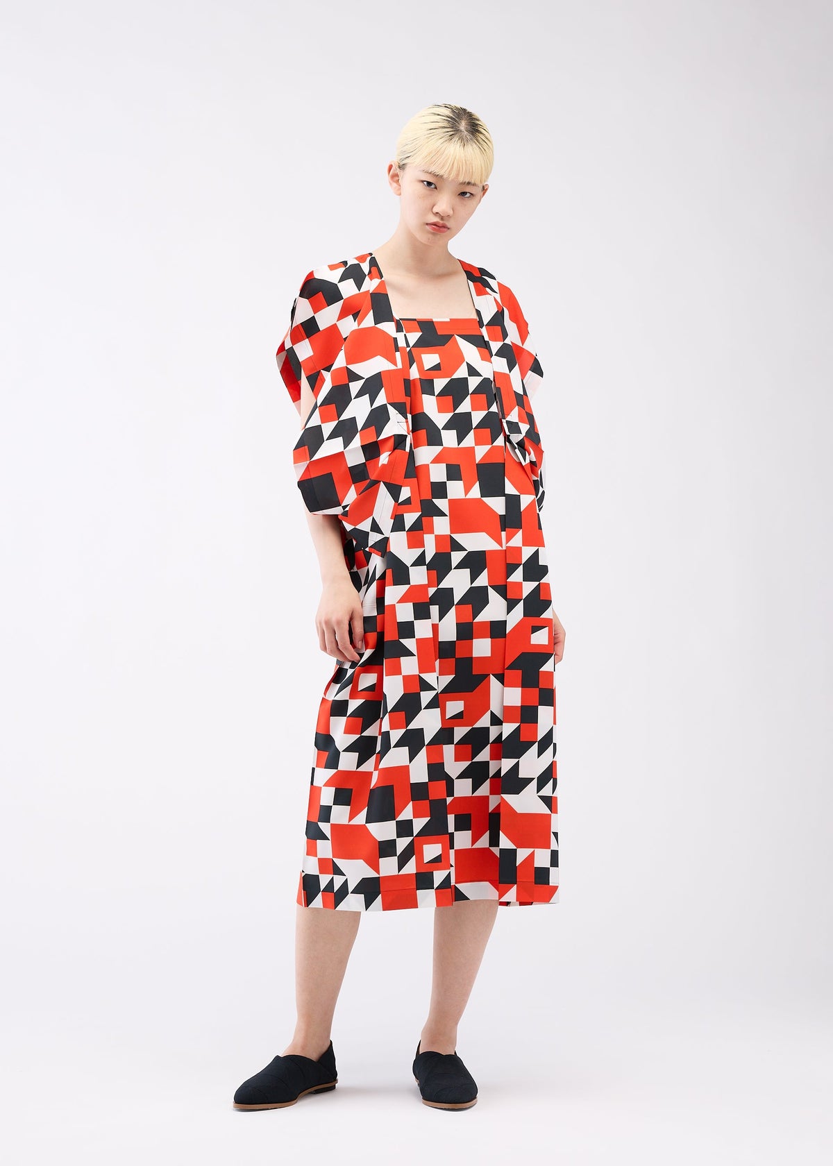 A model wears the 132 5. ISSEY MIYAKE BOX COMPOSITION dress.