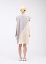 A model wears the 132 5. ISSEY MIYAKE FLAT T BI COLOR dress.