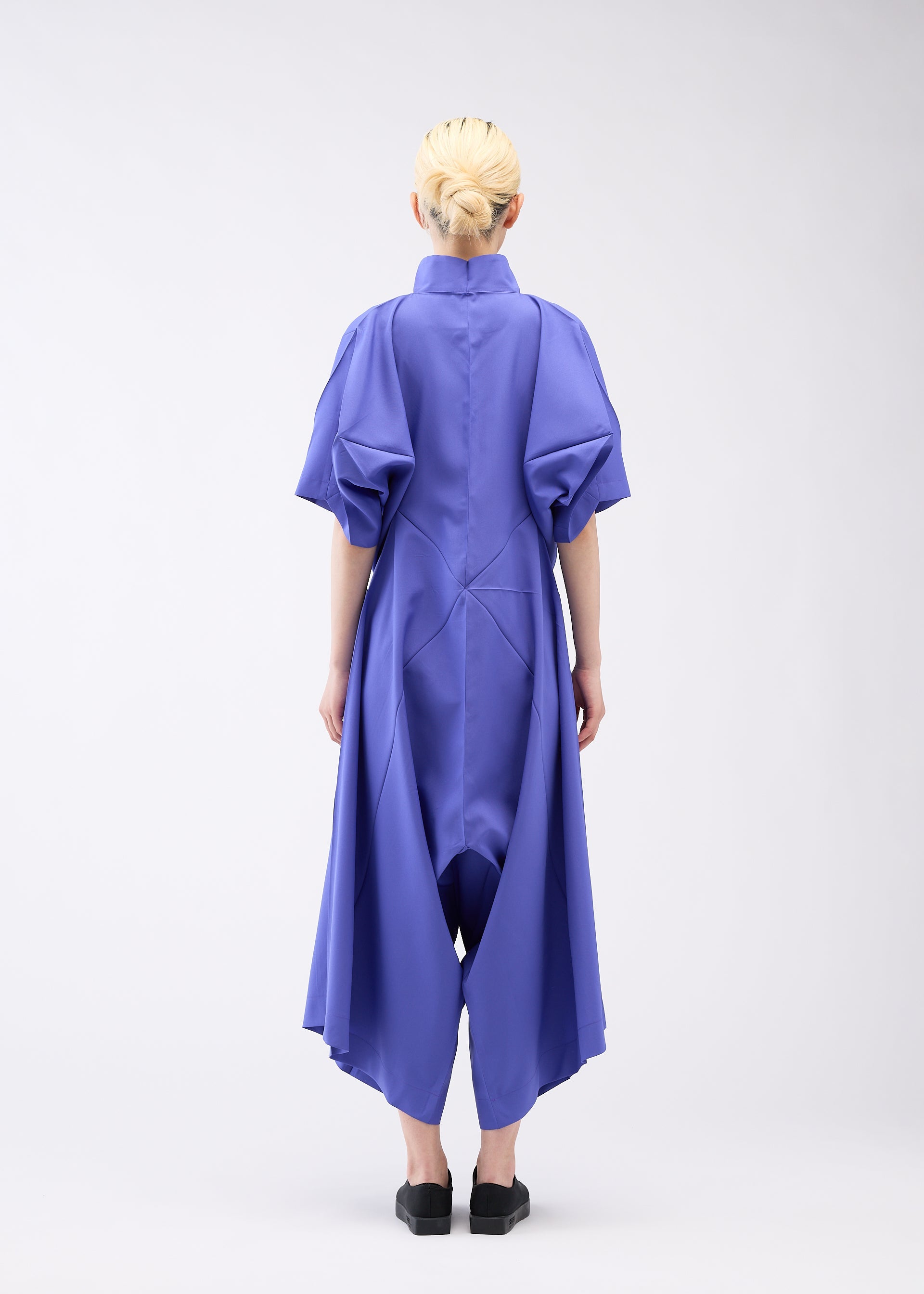 A model wears the 132 5. ISSEY MIYAKE UNIFIED HALF CUBES jumpsuit.