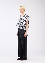 A model wears the 132 5. ISSEY MIYAKE BOX COMPOSITION shirt.