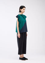 A model wears the 132 5. ISSEY MIYAKE FLAT T BI COLOR shirt.