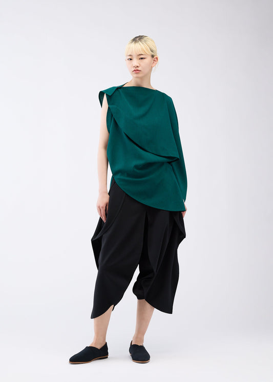A model wears the 132 5. ISSEY MIYAKE FLAT ONE TUCK T shirt.