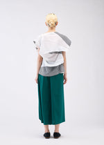 A model wears the 132 5. ISSEY MIYAKE FOLD RAMIE PRINT shirt.