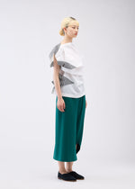 A model wears the 132 5. ISSEY MIYAKE FOLD RAMIE PRINT shirt.
