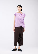 A model wears the 132 5. ISSEY MIYAKE FLAT ONE TUCK T shirt.