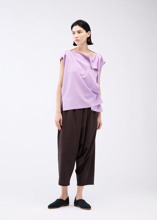 A model wears the 132 5. ISSEY MIYAKE FLAT ONE TUCK T shirt.