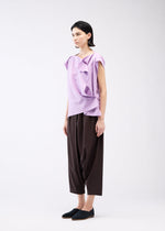 A model wears the 132 5. ISSEY MIYAKE FLAT ONE TUCK T shirt.