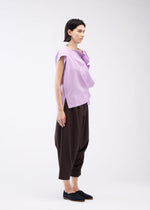 A model wears the 132 5. ISSEY MIYAKE FLAT ONE TUCK T shirt.