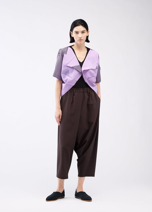 A model wears the 132 5. ISSEY MIYAKE FOLD RAMIE PRINT cardigan.