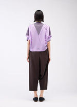 A model wears the 132 5. ISSEY MIYAKE FOLD RAMIE PRINT cardigan.