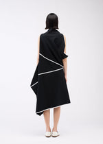 A model wears the 132 5. ISSEY MIYAKE HALF CUBE PATTERN KNIT dress.