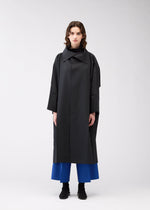 A model wears the 132 5. ISSEY MIYAKE 132 5. FLAT 2 clothing.