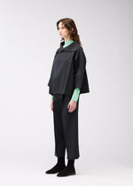 A model wears the 132 5. ISSEY MIYAKE 132 5. FLAT 1 jacket.