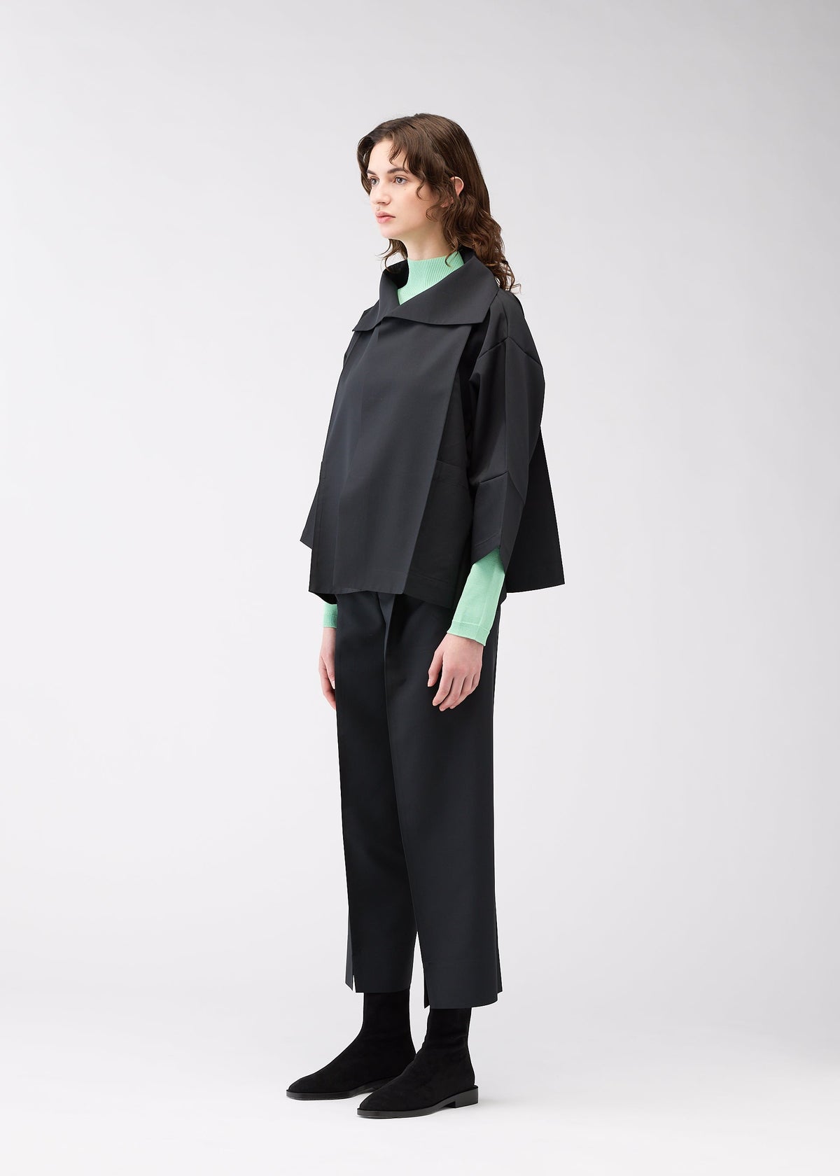 A model wears the 132 5. ISSEY MIYAKE 132 5. FLAT 1 jacket.