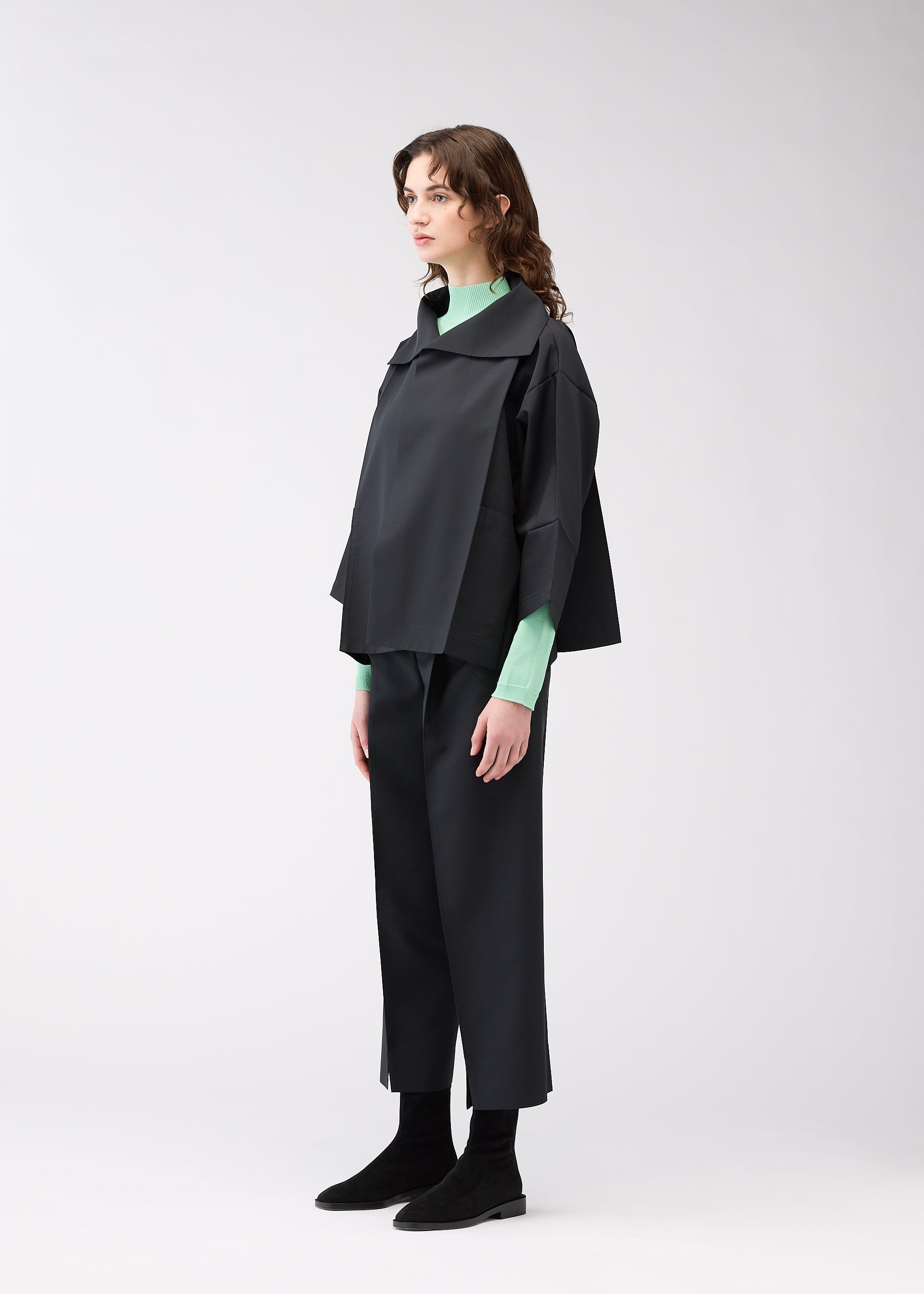 A model wears the 132 5. ISSEY MIYAKE 132 5. FLAT 1 jacket.
