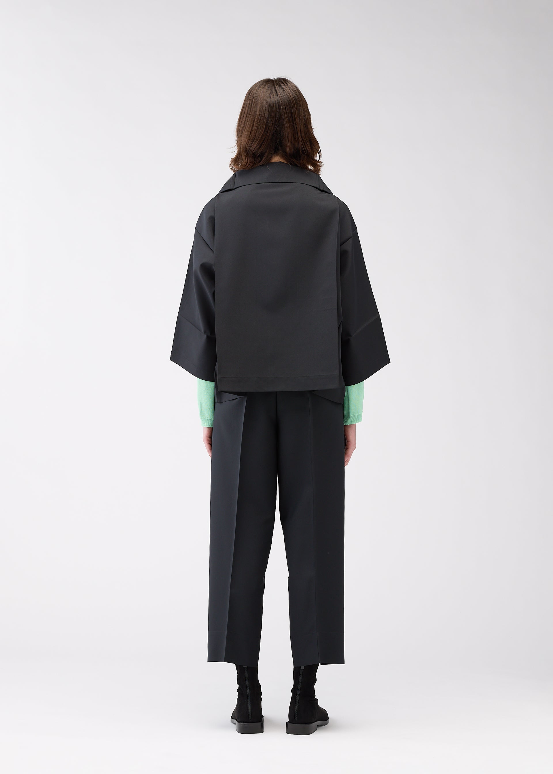 A model wears the 132 5. ISSEY MIYAKE 132 5. FLAT 1 jacket.
